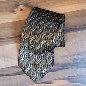 Audrey Buckner gold patterned tie with brilliant blue accents
